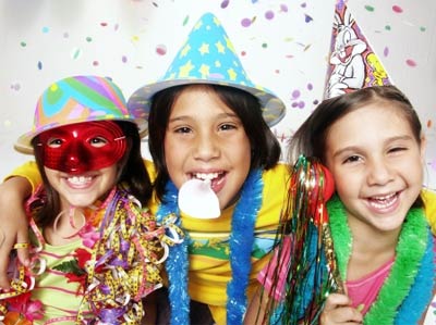 kids in party hats smiling