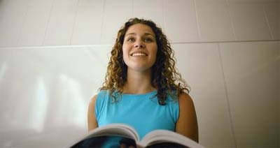smiling girl holding book