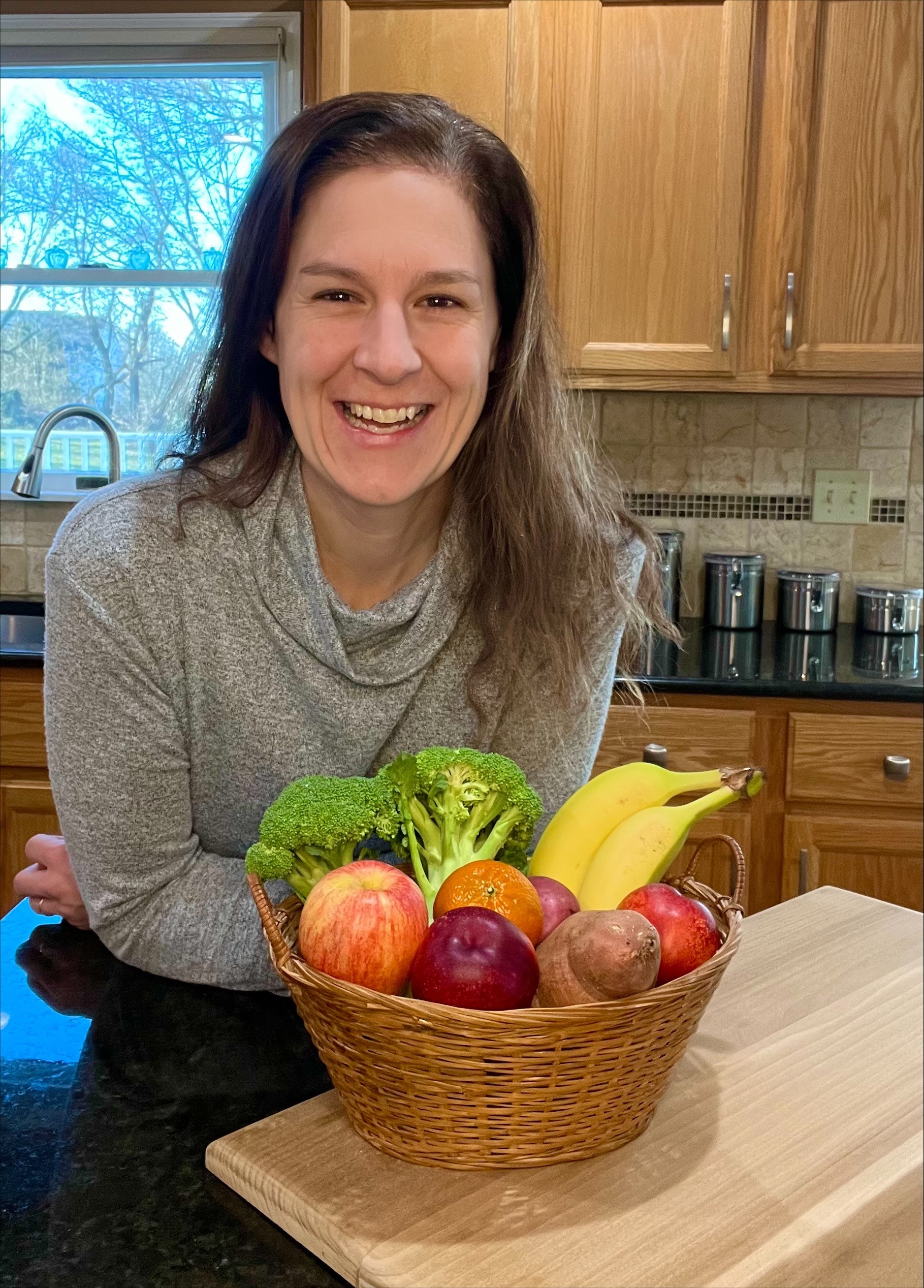 Dietician, for Regional YMCA of Western CT Jessica Clark in from of a fruit bowl